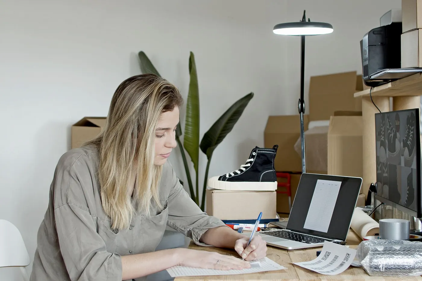Owner of a small business working at her desk
